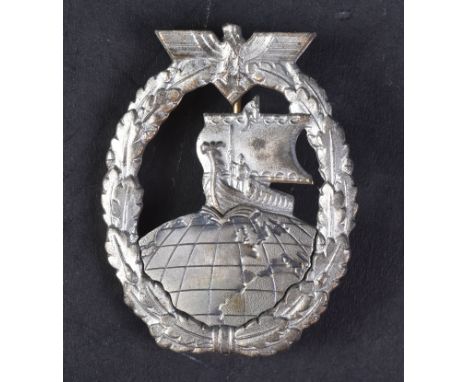 An original WWII Second World War Third Reich Nazi German Kriegsmarine Auxiliary Cruiser badge. The badge depicting a Viking 