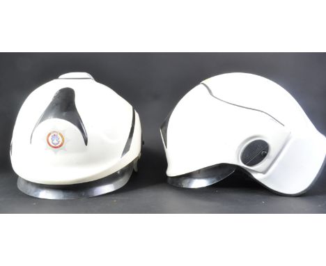 Two vintage 1995 Cromwell made Fire Brigade / Firefighter F600 helmets. The white helmets with flip down perspex eye guards, 