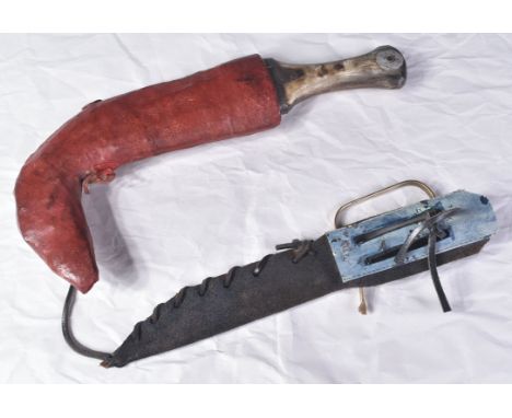 A 20th Century South Arabian Jambiya dagger along with a small Persian knife. The Jambiya with a waisted grip of horn constru