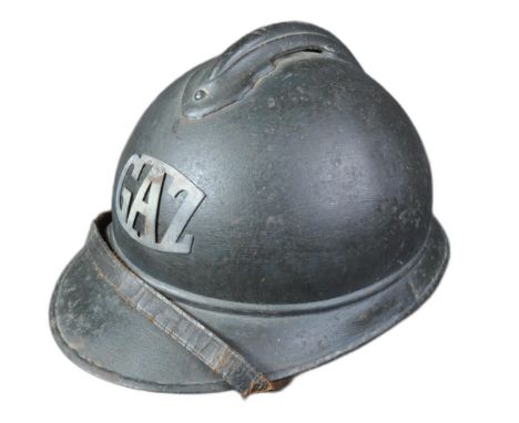 A WWI First World War French M15 Adrian helmet with applied Gas Troop badge.&nbsp;The helmet of usual form split pin ' comb '