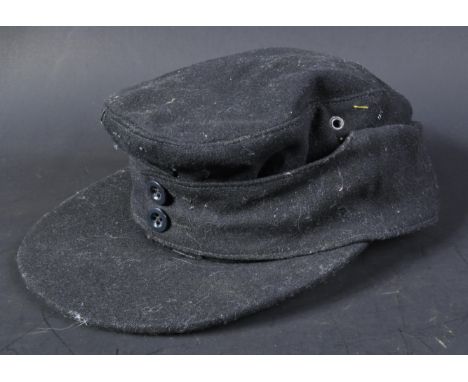 A WWII Second World War Third Reich Nazi German M43 Panzer side cap. Black wool construction with removed insignia. The front