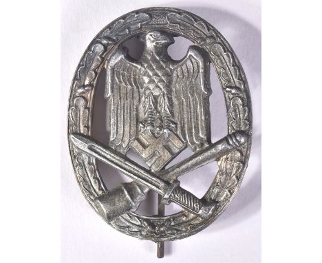 A WWII Second World War interest Third Reich Nazi German General Assault badge. The badge being a solid back example with oak