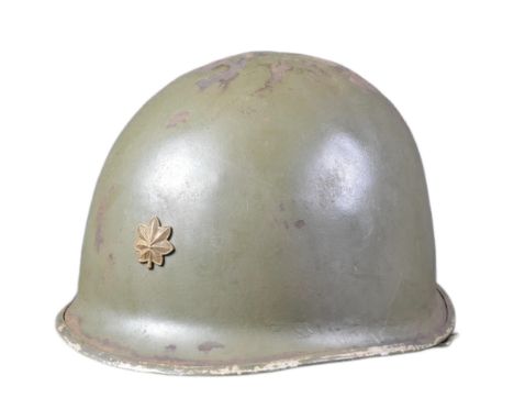 A WWII Second World War US United States Army Major Officers M1 steel combat helmet. Swivel bale example with front split sea