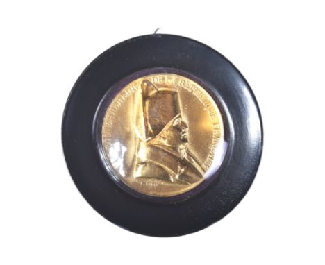 Napoleon Bonaparte - a gilt plaque&nbsp;bearing a relief profile portrait of Napoleon Bonaparte after Emile Ragot. Housed in 