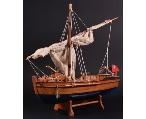 From a Private Collection - a wooden model of a small 19th Century naval sailing boat / vessel. Single mast, with a large cen