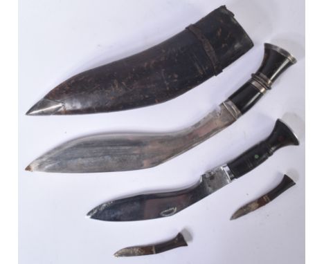 Two vintage Nepalese / Gurkha Regiment Kukri knife dagger. Both examples with white metal capped pommels and carved horn grip