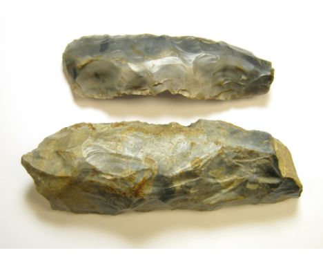 Two Prehistoric Flint Axeheads,A mesolithic tranchet axe/adze circa 9000-4000 BC, some damage at the cutting edge, 153mm/350g