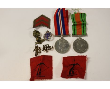 WW2 British ATS Medal group and insignia. British War and Defence Medal with ribbons. Pair of brass ATS shoulder titles, RA f