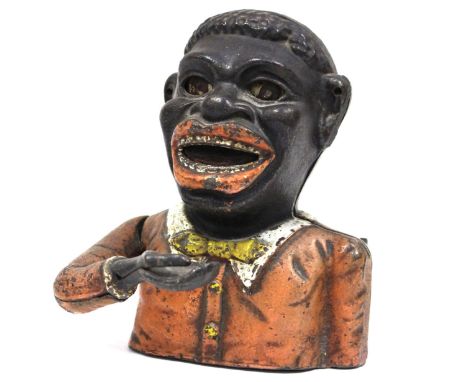 A late 19th Century painted cast iron Money Bank, "JOLLY N****R BANK",hinged arm, retracting tongue, rolling eyes, wearing a 