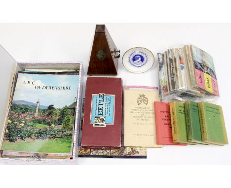 A box of ephemera, together with a bag of tea card albums, Postcards Observers book and carved stone chessmen and a metronome