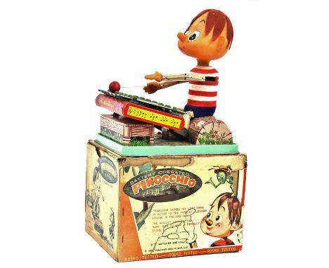 Rosco Toys: A Rosco Toys 1963 Battery Operated "Pinnocchio with Glowing Face", playing a Xylophone, within original box (box 