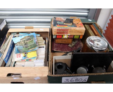 A box of cigarette cards and postcards, with a gentlemen's ebony dressing table set, novelty ebony inkwell, boxed Vulcan chil