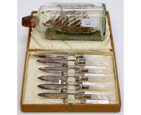 A Walker and Hall cased EPNS fish knife and fork set, with a Gordons Gin early ship in bottle (2) 