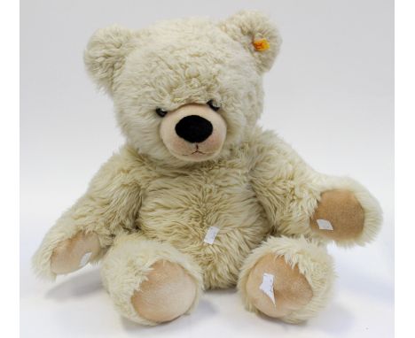 A cream Steiff Teddy, measuring approx 65 cms long, with Steiff tag in its ear
