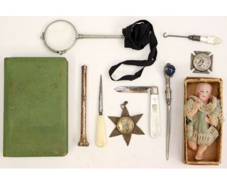 A ceramic miniature doll with Manchester and Salford savings money box, silver bladed mother of pearl pen knife, etc (one bag