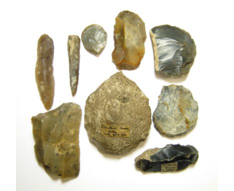 Prehistoric Stone Tool GroupA collection of flint tools, including scrapers, blades and an arrowhead, some with inked labels 