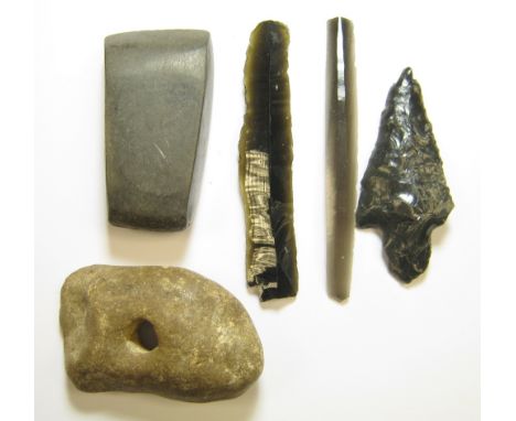 Neolithic Stone Axe and Obsidian GroupA small ground and polished greenstone Axe, trapeziodal with flat margins. Eastern Euro