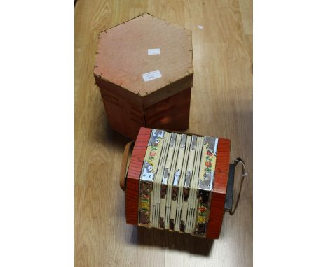 A vintage boxed twenty button Scholer concertina, made in Germany