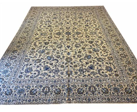 FINE ISPHAHAN DESIGN CARPET, 409cm x 306cm, all over palmette and scrolling vine design on a jade field within corresponding 