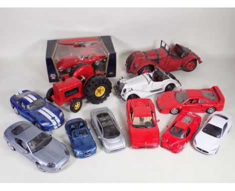 A boxed Burago Special Collection 1/18 scale Jaguar E-type, seven other Burago and other large scale model Vehicles, a boxed 