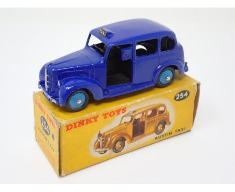 A rare boxed Dinky Toys No.254 violet blue Austin Taxi with light blue hubs 