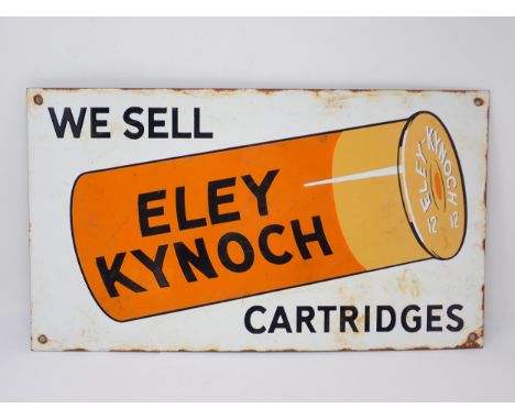 An enamel 'We Sell Eley Kynoch Cartridges' Sign 18 1/2in W x 10 1/2in H 