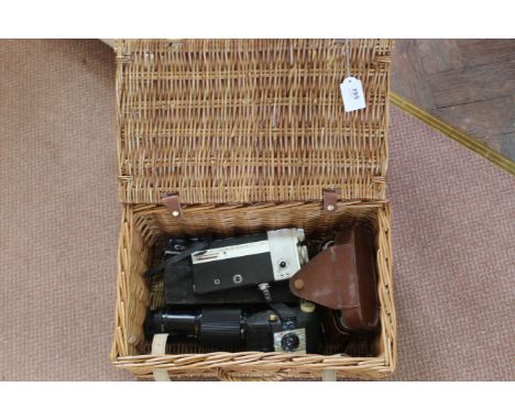 A wicker basket with a Canon Cine Canonet 8 cine camera, Cine Zoom lens, 'Agifold' camera plus a box Brownie 127 camera