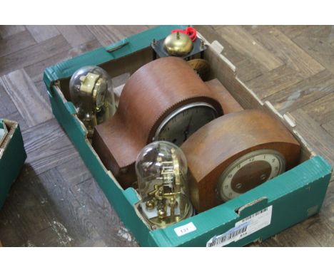 A German 'Hermle' clock under glass dome, 8 1/2" high, two wood cased mantel clocks (as found) plus two further mantel clocks