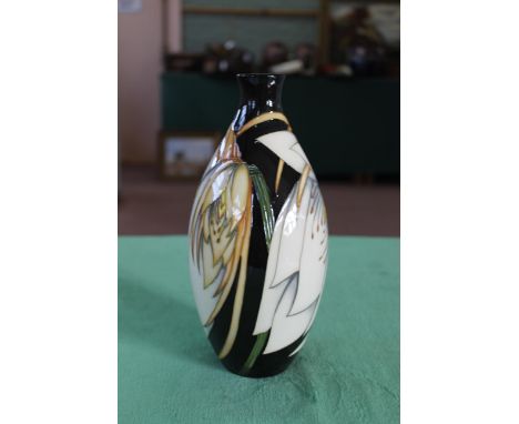 A Moorcroft 'Moon Flower' pattern vase, 2007 by Philip Gibson, 9 1/2" high, boxed