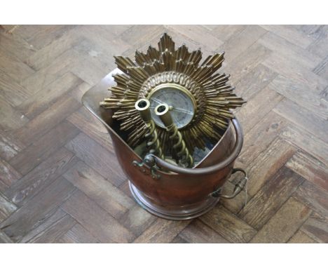 A 19th Century helmet coal scuttle, a pair of twisted stem brass candlesticks plus a gilded metal 'sunburst' barometer