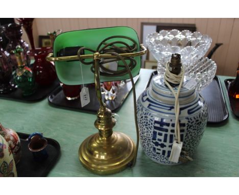 A brass students lamp with green glass shade plus a blue and white ginger jar converted to a lamp