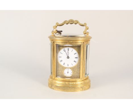 A Victorian heavily engraved brass oval carriage clock dated 1865, chiming with alarm, no obvious makers mark, engraved dedic