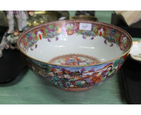 An early 19th Century Chinese export Canton enamel bowl with panels depicting courtiers in a landscape (haircrack)