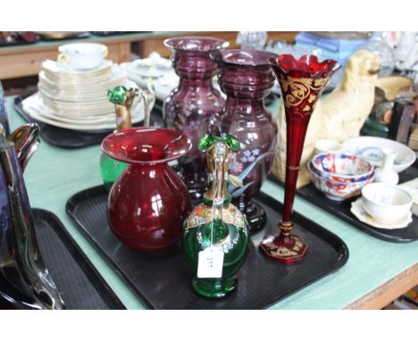 A pair of mauve glass enamel decorated vases, ruby glass trumpet vase, red glass vase plus a pair of green glass, enamel deco