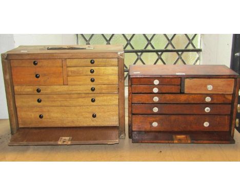 Two vintage oak framed engineers portable tool chests of varying size, each enclosed by a removable door enclosing numerous s