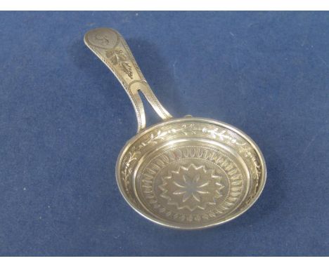 Good Georgian silver 'frying pan' caddy spoon, the bowl embossed with a star and various other banded decoration, the handle 