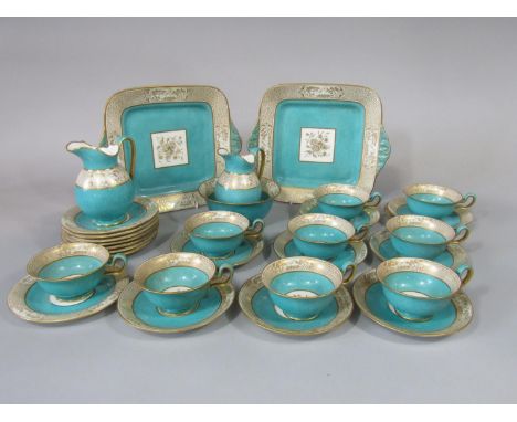 A collection of Wedgwood tea wares with gilt border decoration in the chinoiserie manner with speckled turquoise ground, patt