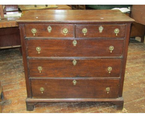 A mid-Georgian period Countrymade chest of three long and two short drawers in oak, raised on bracket support, 96cm wide 