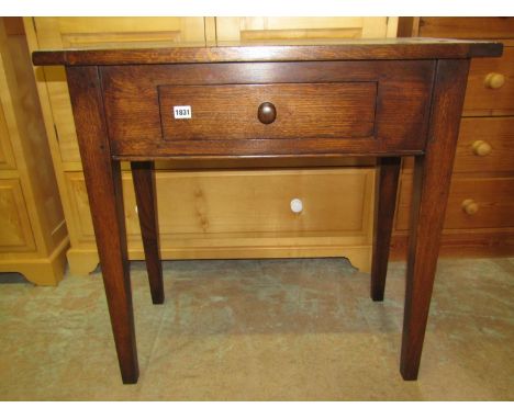 A good quality reproduction oak side table, the rectangular top with cleated ends over a frieze drawer and square tapered sup