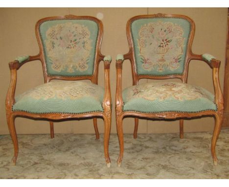 A pair of late 19th century futiles/salon chairs, with floral tapestry upholstered seats and shield shaped backs within shape