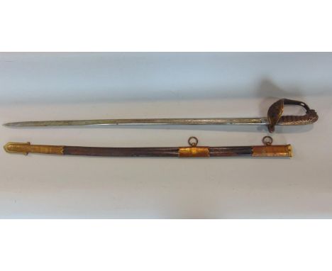 1827 pattern naval officers sword, the engraved blade 80cm long, with leather and brass mounted scabbard 