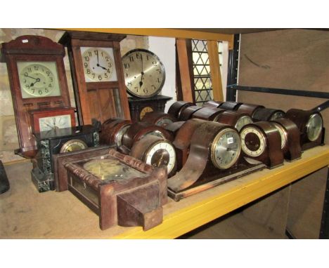 A collection of 18 domed top mantle clocks with circular dials, two train and three train examples by Smiths, Enfield, Everet