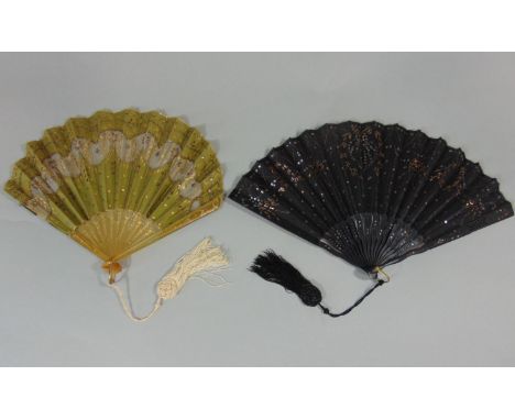 2 early 20th Century French fans, the first with olive silk leaf cut away to reveal fine gauze, overlaid with sequins and fin