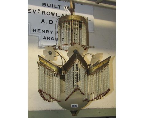 A 1920s/30s hanging ceiling light, the reeded brass frame supporting glass spiral rods and flower detail 