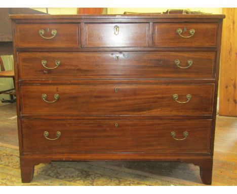 A Georgian mahogany chest of three long and three short drawers with string banded inlay, raised on bracket supports, 115cm w
