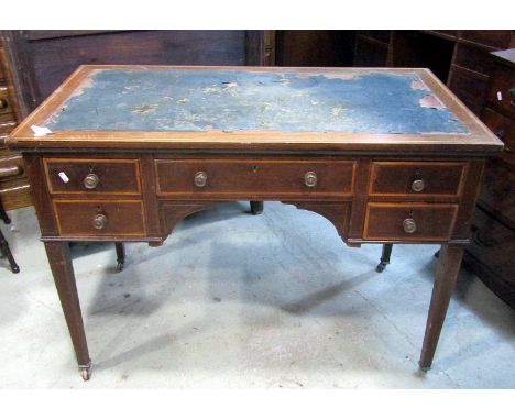 An inlaid Edwardian mahogany writing table with crossbanded detail and box wood stringing, worn inset leather top over an arr