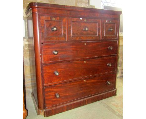 A Victorian mahogany bedroom chest fitted with an arrangement of six oak lined drawers with turned knob handles with inset mo