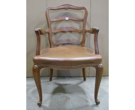 An oak open elbow chair, the moulded frame with shield shaped ladder-back, raised on scrolled cabriole forelegs 