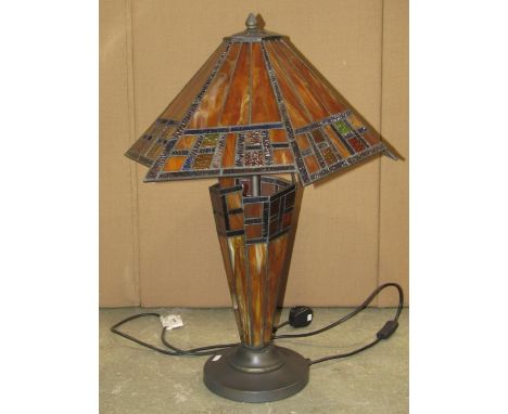 A contemporary Tiffany style table lamp and shade with leaded glass panels 