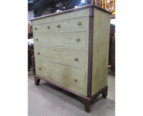 A 19th century oak bedroom chest of two short over three long graduated drawers flanked by split moulded columns and raised o